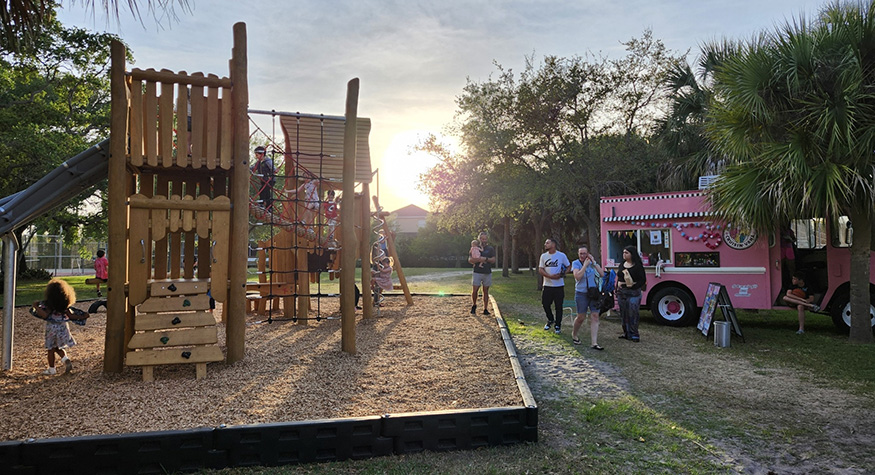 Kids on outdoor playground at sunset