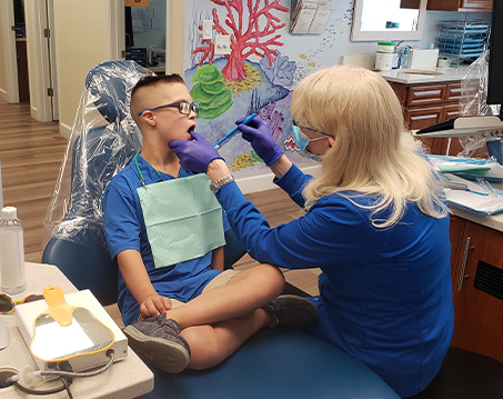 Young boy receiving a dental exam