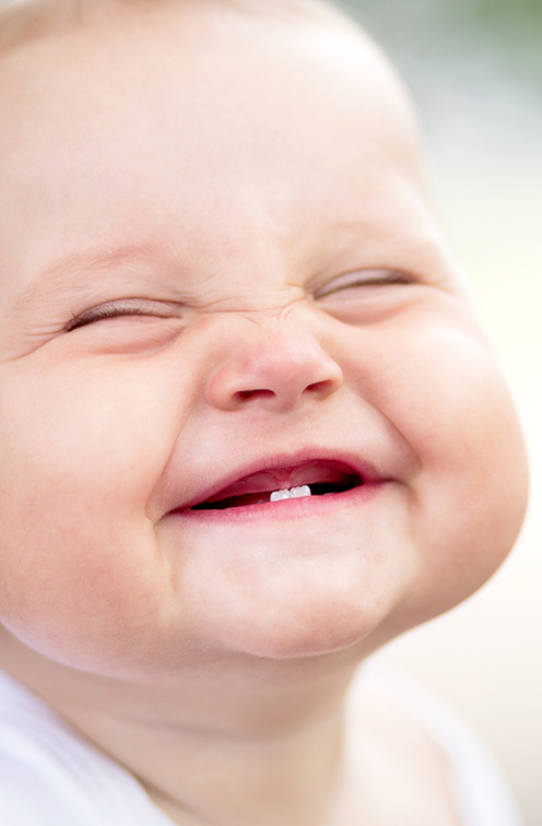 Baby grinning after sedation dentistry for kids in Satellite Beach